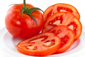 Fresh red tomatoes isolated on white